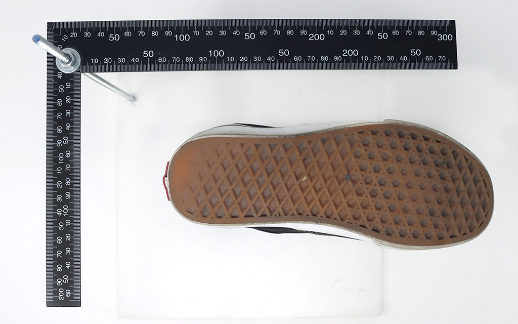 Measuring shoes and cataloging their treads are tasks Grand Canyon University students do as they add shoes to a shoeprint database they’re working on with the Phoenix Police Department. Photo taken at GCU in Phoenix on Nov. 3, 2022. (Photo by Alexia Faith/Cronkite News)