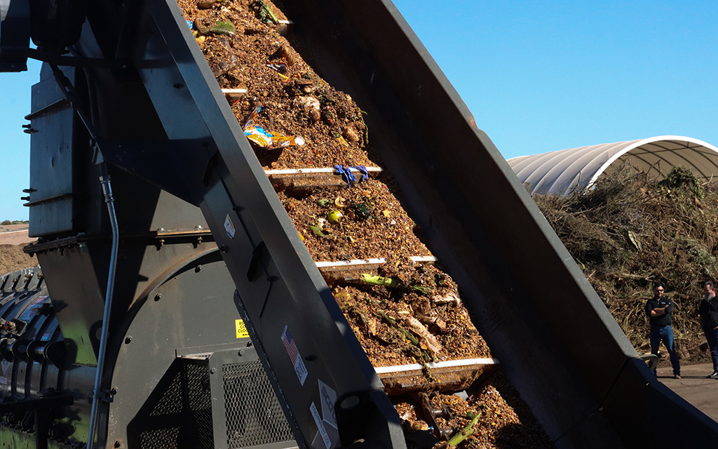 Trash enters the sorting machine at the 27th Avenue Compost Facility in Phoenix Feb. 2, 2023. (Photo by Lydia Curry/Cronkite News)
