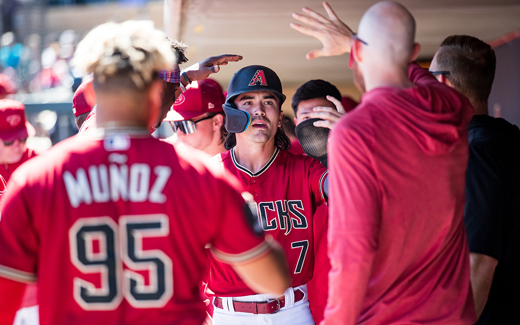Diamondbacks outfielder Corbin Carroll needed only 32 games to impress the front office and earn a contract extension worth $111 million. The 22-year-old enters the upcoming season with high expectations but says "there's no added pressure." (Photo by John E. Moore III/Getty Images)