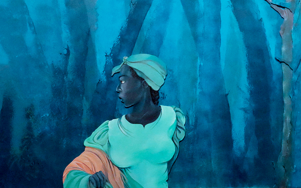 Rhonda “Shakur” Carter said she finds inspiration from family, community and history. “I have this piece that looks like Harriet Tubman and she’s running to freedom. It kind of feels like we’re still fighting for freedom and to be heard,” Shakur said. (Photo by Sierra Alvarez/Cronkite News)
