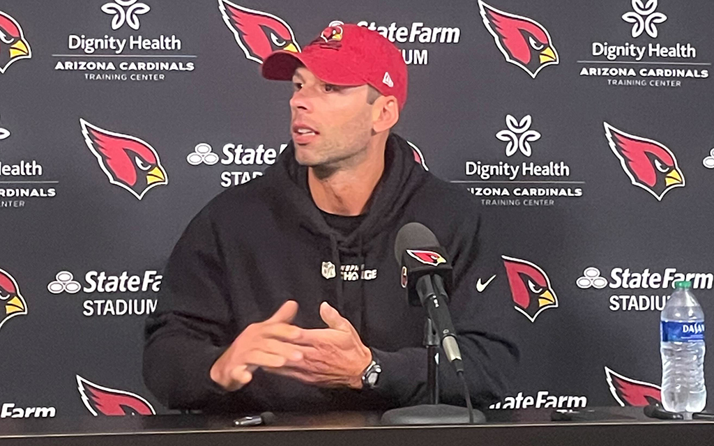 Cardinals head coach Johnathan Gannon talks with media at press conference.
