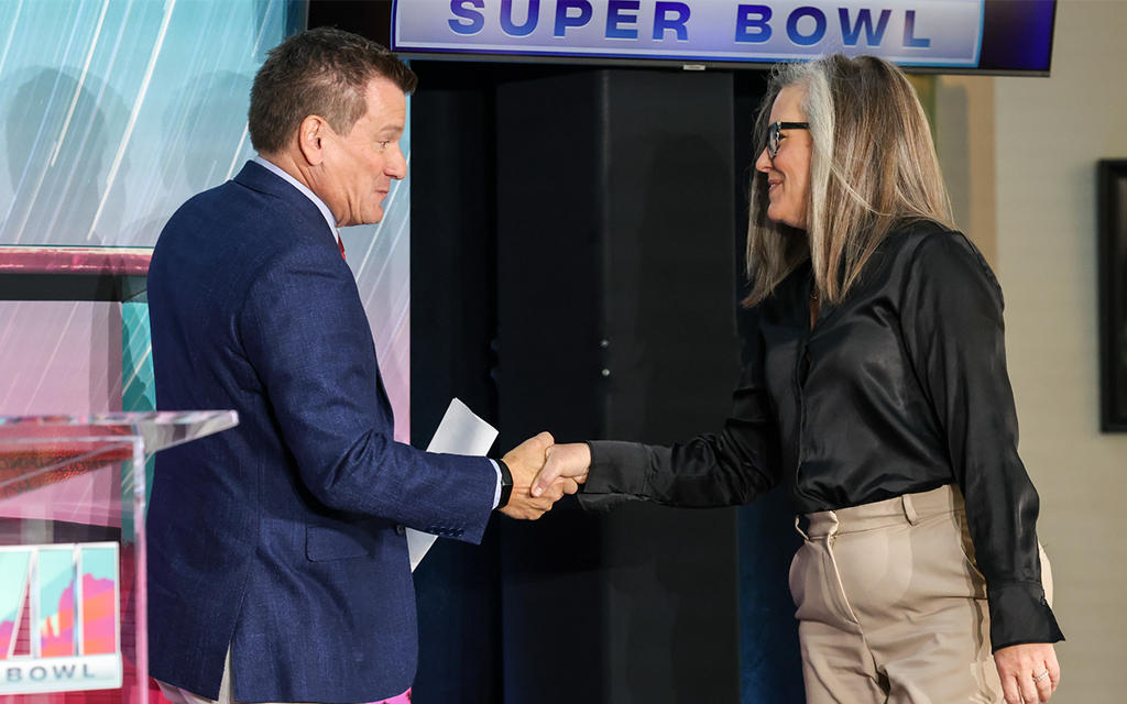 Handshake between Cardinals owner Michael Bidwill and Arizona gov. Katie Hobbs