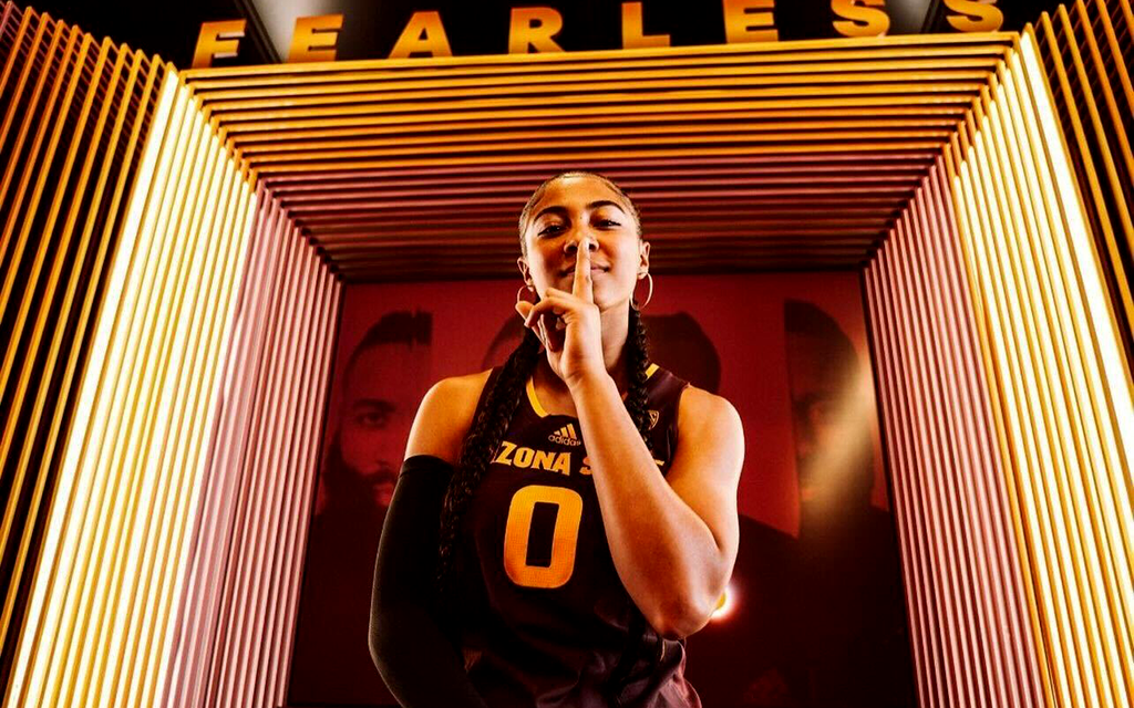 Taliyah Henderson posing in an ASU jersey.