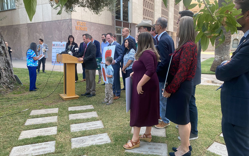 Arizona Senate President Warren Petersen, R-Gilbert, is surrounded by Republican lawmakers as he discusses their proposal to increase pay for Arizona K-12 public school teachers. (Photo by Jacob Snelgrove/Cronkite News)
