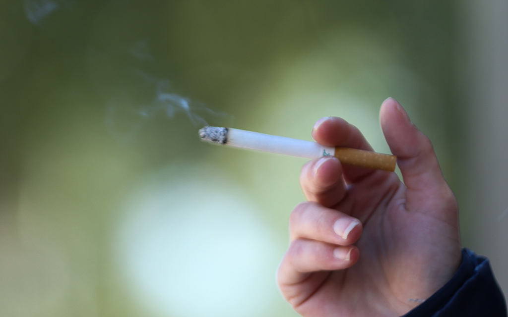 Person holding a cigarette