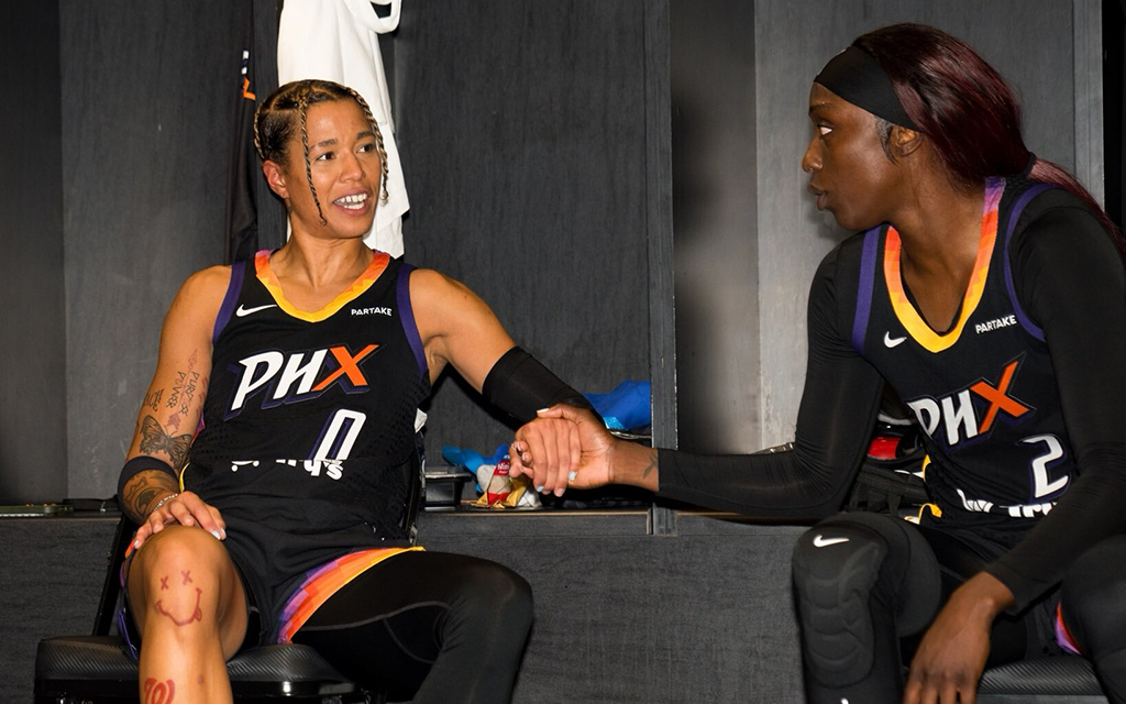 Natasha Cloud (left) and Kahleah Copper (right), congratulate each other after combining for 56 points during Sundays victory against the Los Angeles Sparks. (Photo courtesy of Phoenix Mercury)