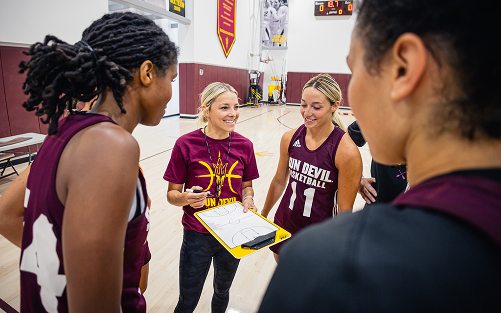 Molly Miller coaches her players at practice.